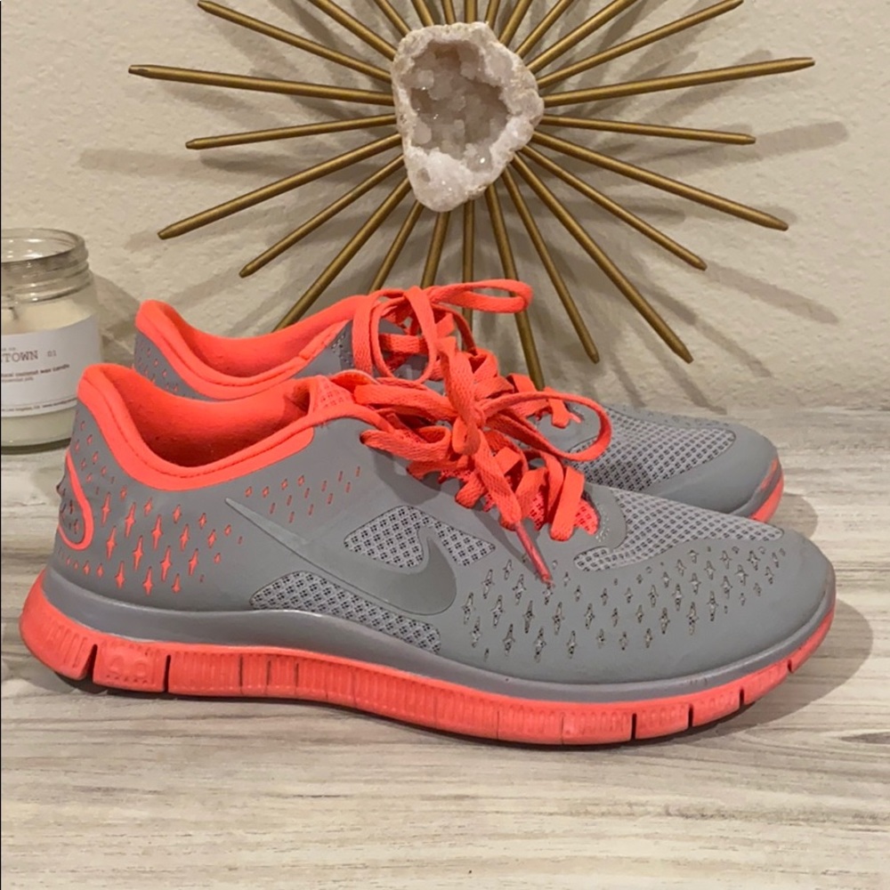 Grey and hot pink Nike Free Runs